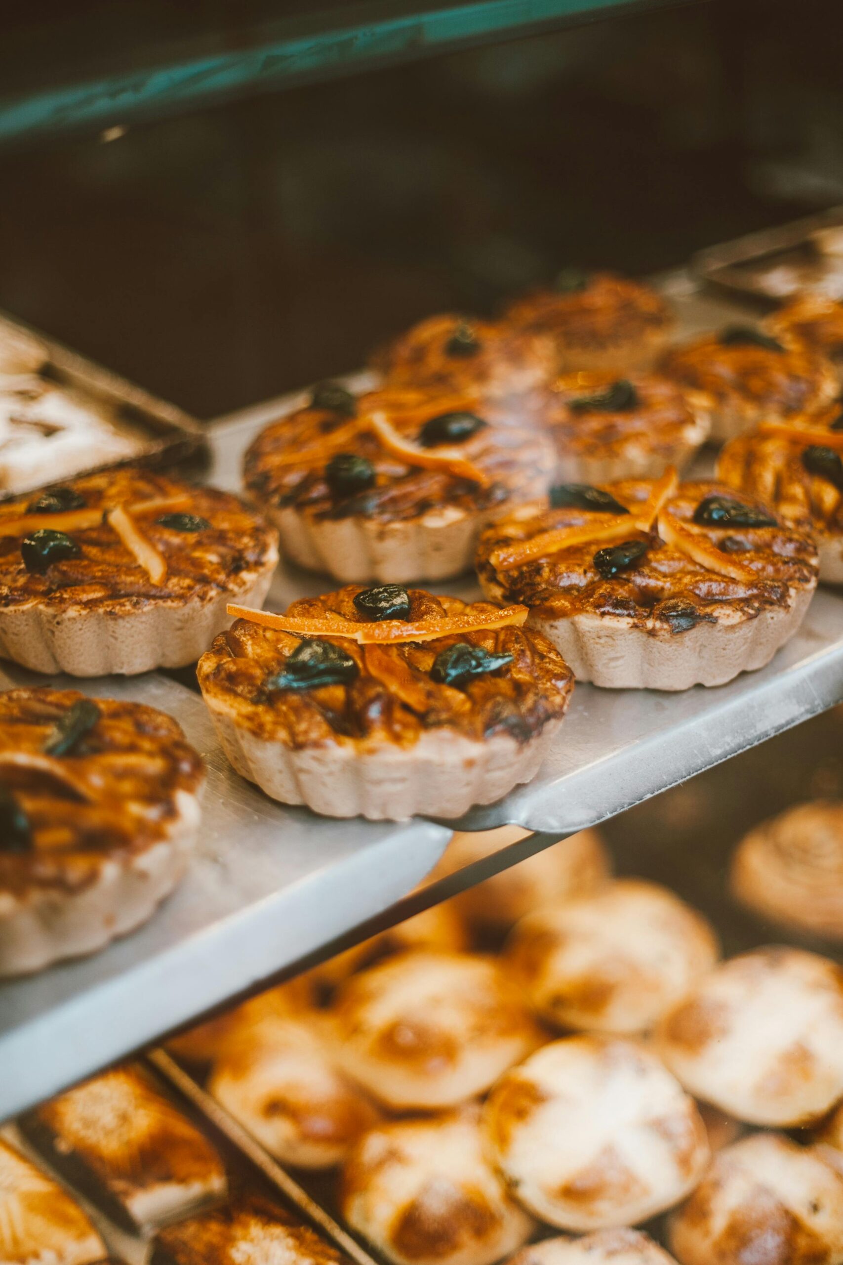 Close-up of assorted tarts with fruit, perfect for food photography and culinary displays.