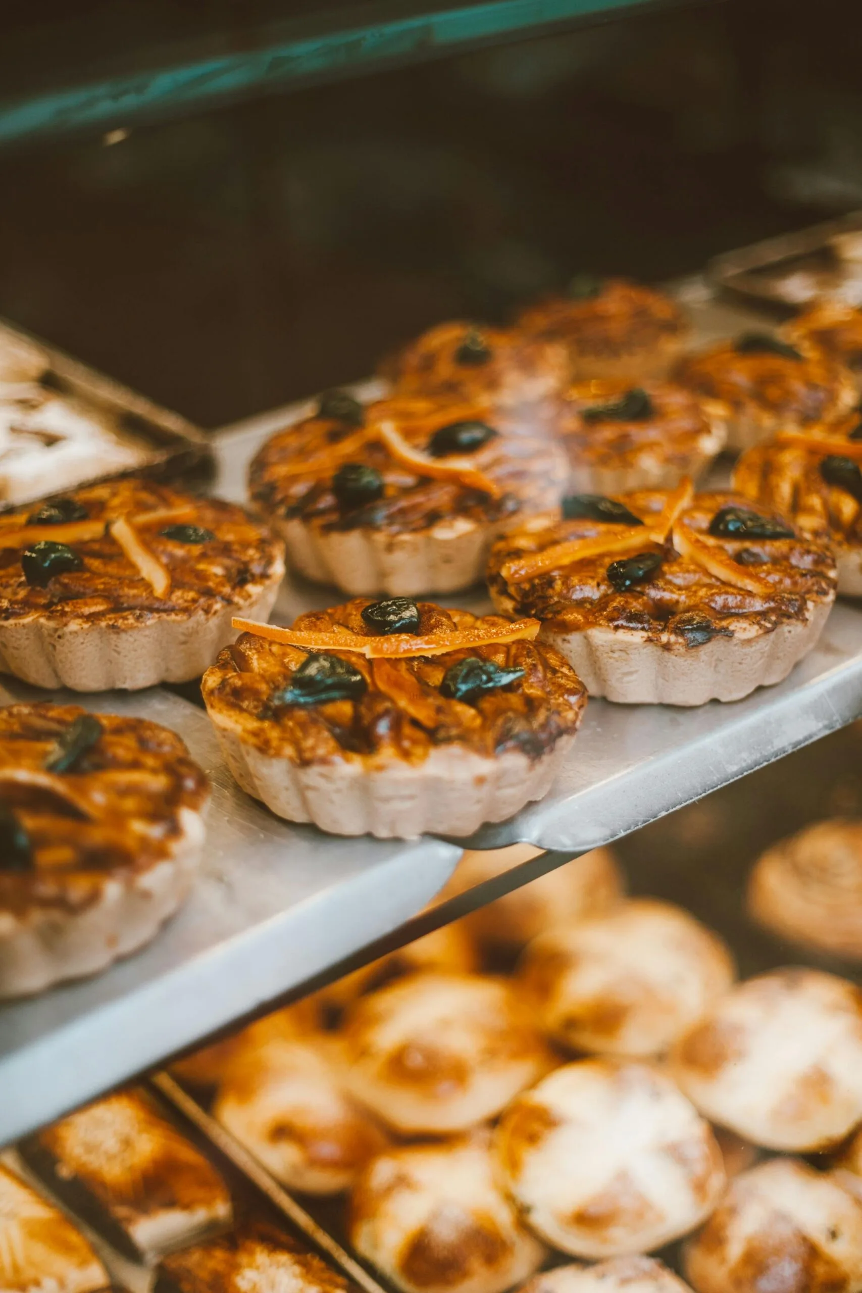 Close-up of assorted tarts with fruit, perfect for food photography and culinary displays.